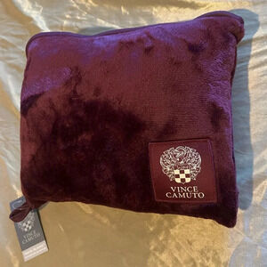 Vince camuto travel blanket with zipper storage bag.